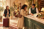 French for Hospitality illustration: a hotel receptionist helps a guest find her way on a city map at the reception desk.